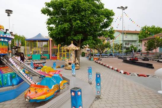 Rides and colourful cars at Topolino Park in Gatteo Mare